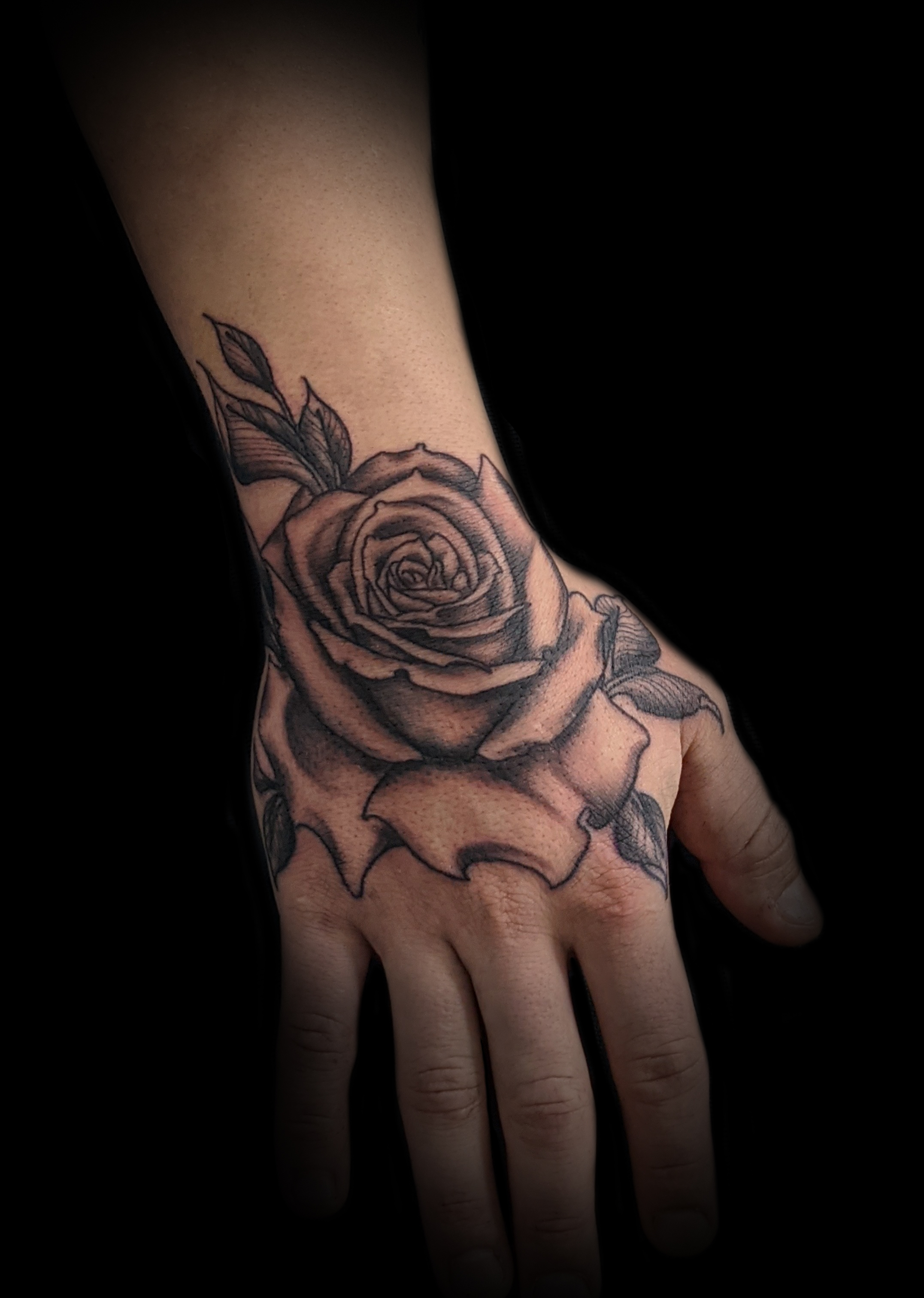 Rose hand tattoo